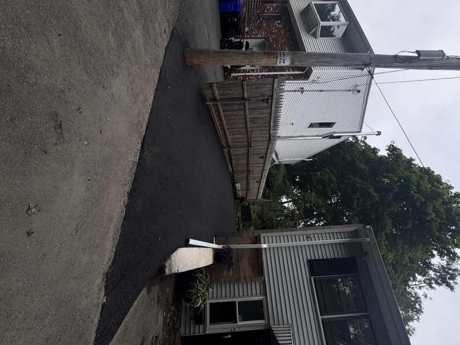 Freshly paved driveway restored at final grade